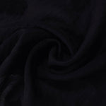 Draped texture of formal black big leaf embossed viscose jacquard fabric for garment layers.