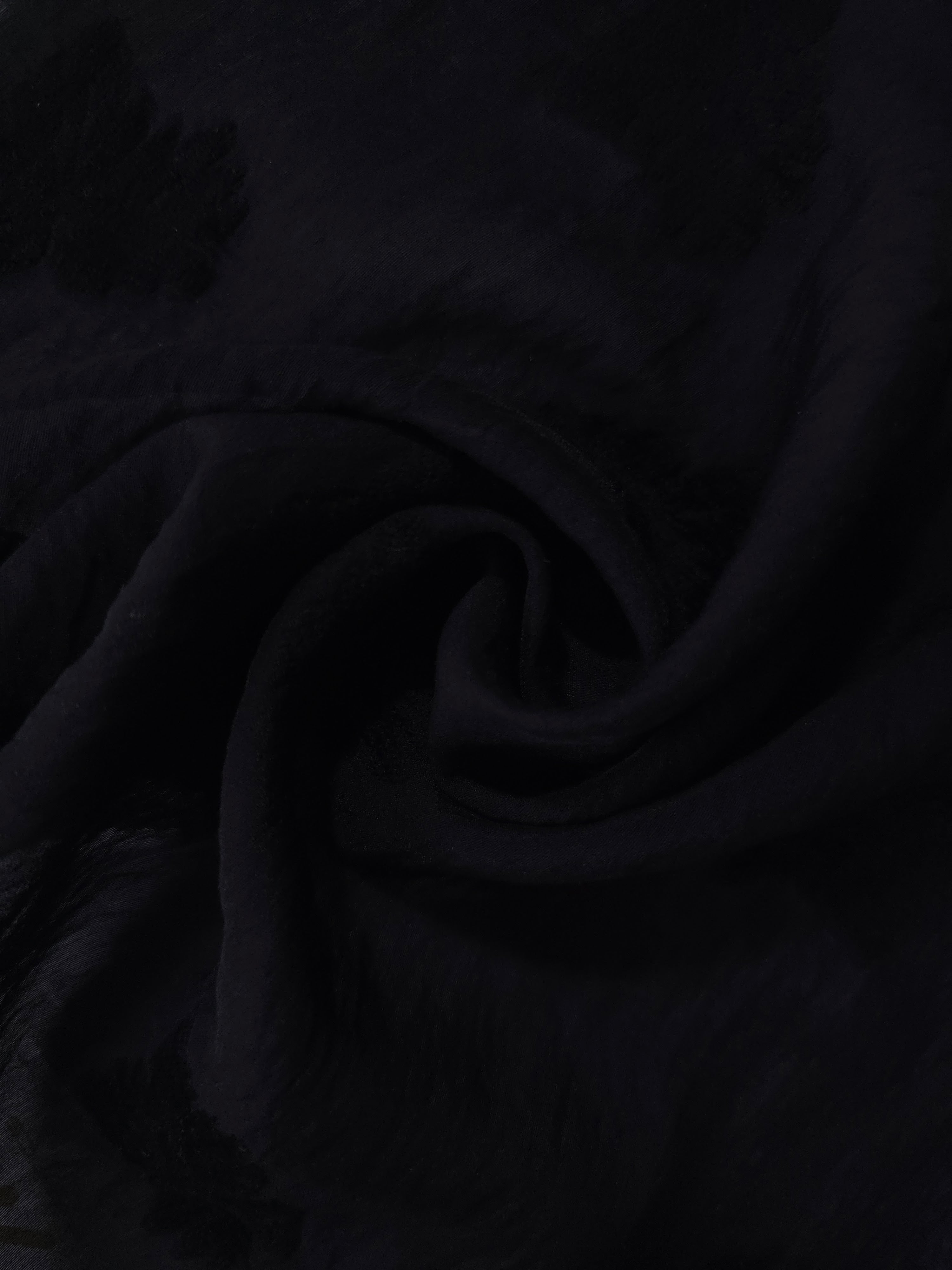 Draped texture of formal black big leaf embossed viscose jacquard fabric for garment layers.