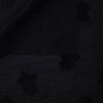 Front and back view of formal black big leaf embossed viscose jacquard fabric.