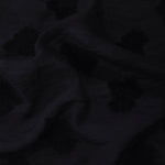 Drape view of formal black big leaf embossed viscose jacquard fabric for kaftan overlays.