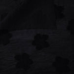 Front and back view of formal black flower embossed viscose jacquard fabric.