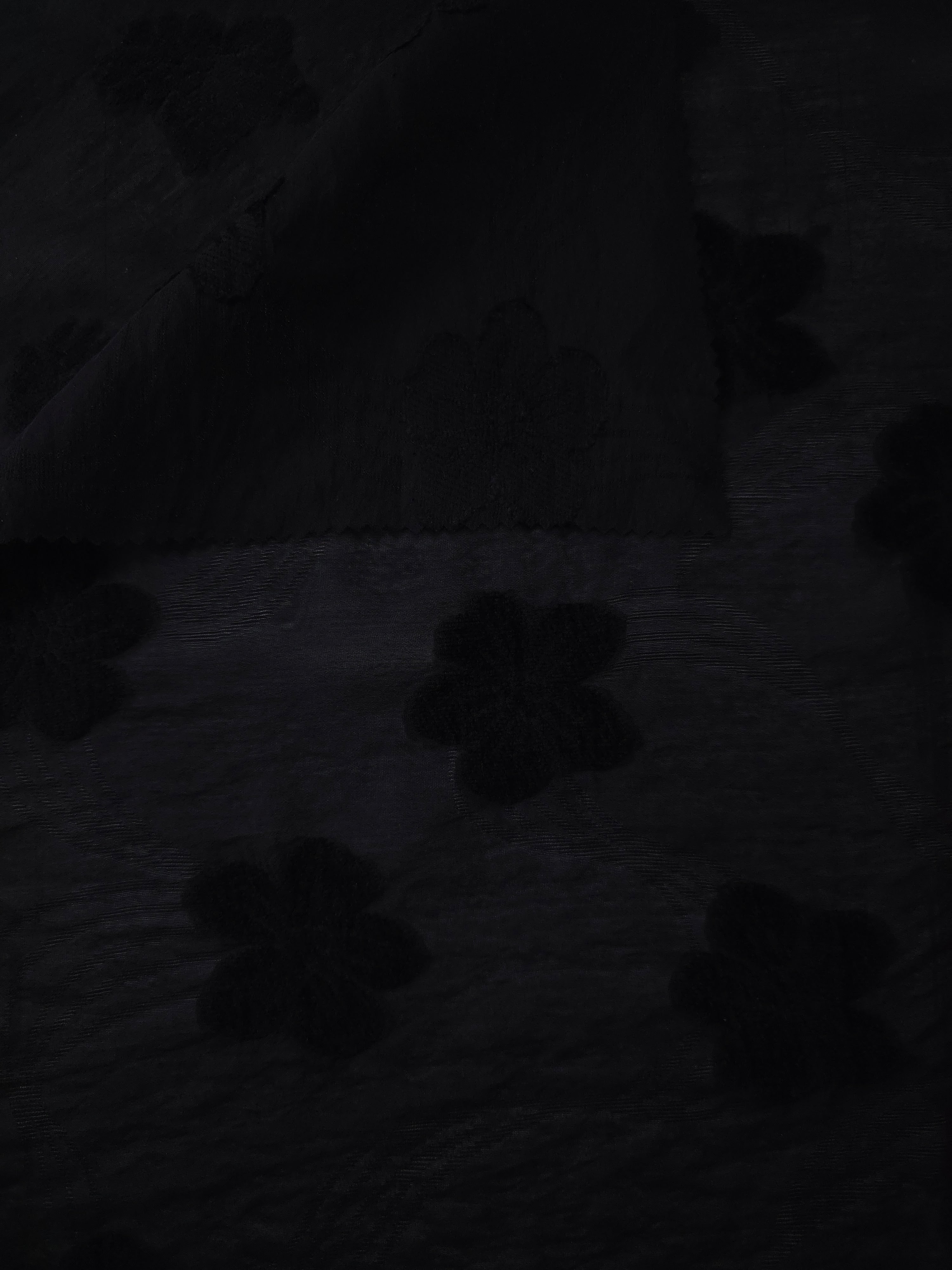 Front and back view of formal black flower embossed viscose jacquard fabric.