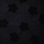 Wide view of formal black flower embossed viscose jacquard fabric with tonal raised motif.