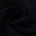 Formal black leaf embossed viscose jacquard fabric closeup for sheer overlays.