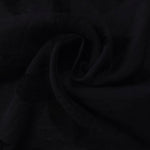 Draped texture of formal black leaf embossed viscose jacquard fabric for garment layers.