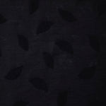 Wide view of formal black leaf embossed viscose jacquard fabric with tonal raised motif.
