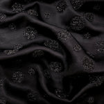 Metallic Black viscose jacquard fabric with Metallic Confetti Dot design, textured surface view