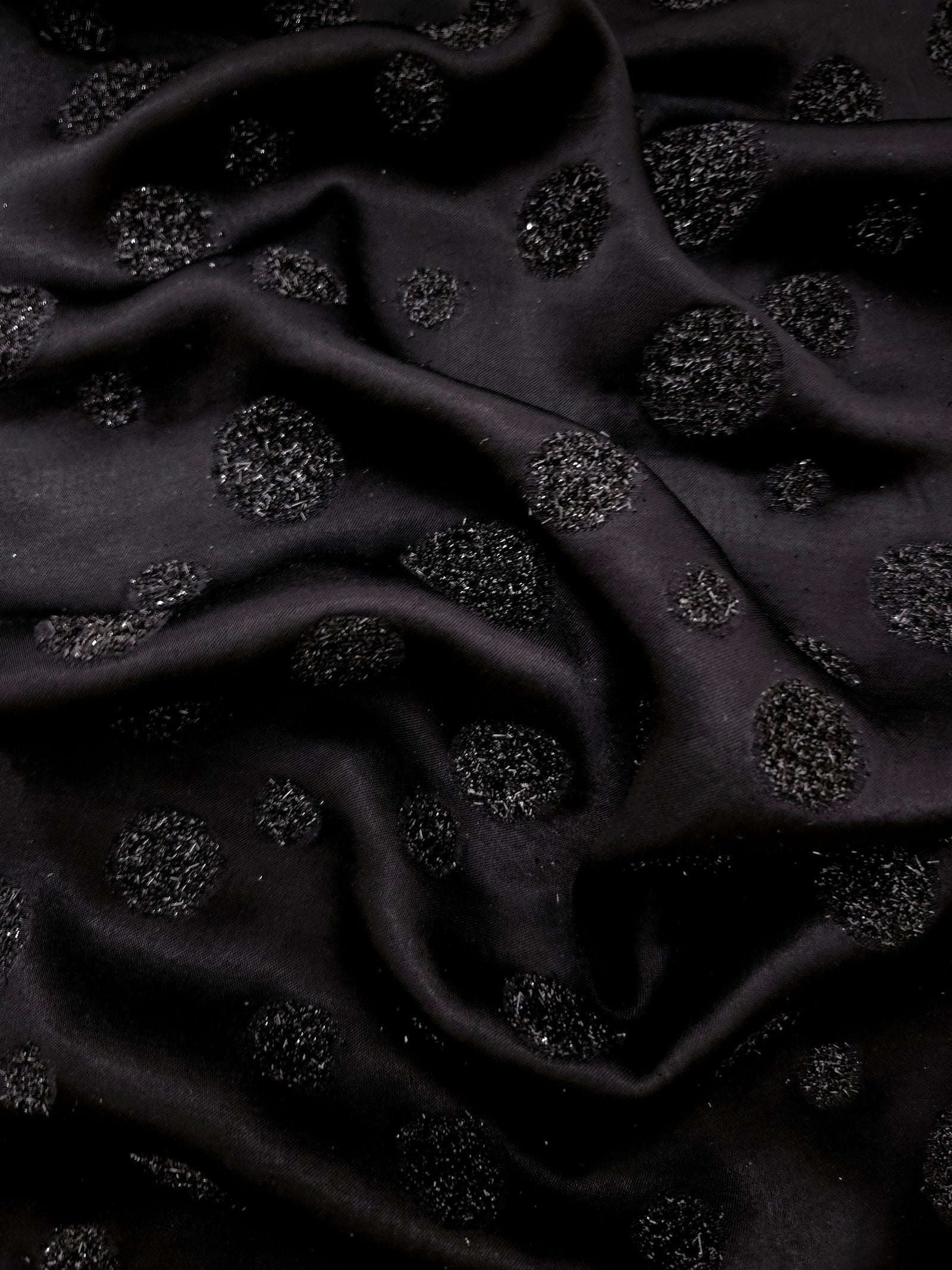 Metallic Black viscose jacquard fabric with Metallic Confetti Dot design, textured surface view