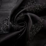 Folded Metallic Black viscose jacquard fabric with organic reflective brush marks
