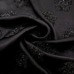 Folded Metallic Black viscose jacquard fabric with organic metallic pebble motif