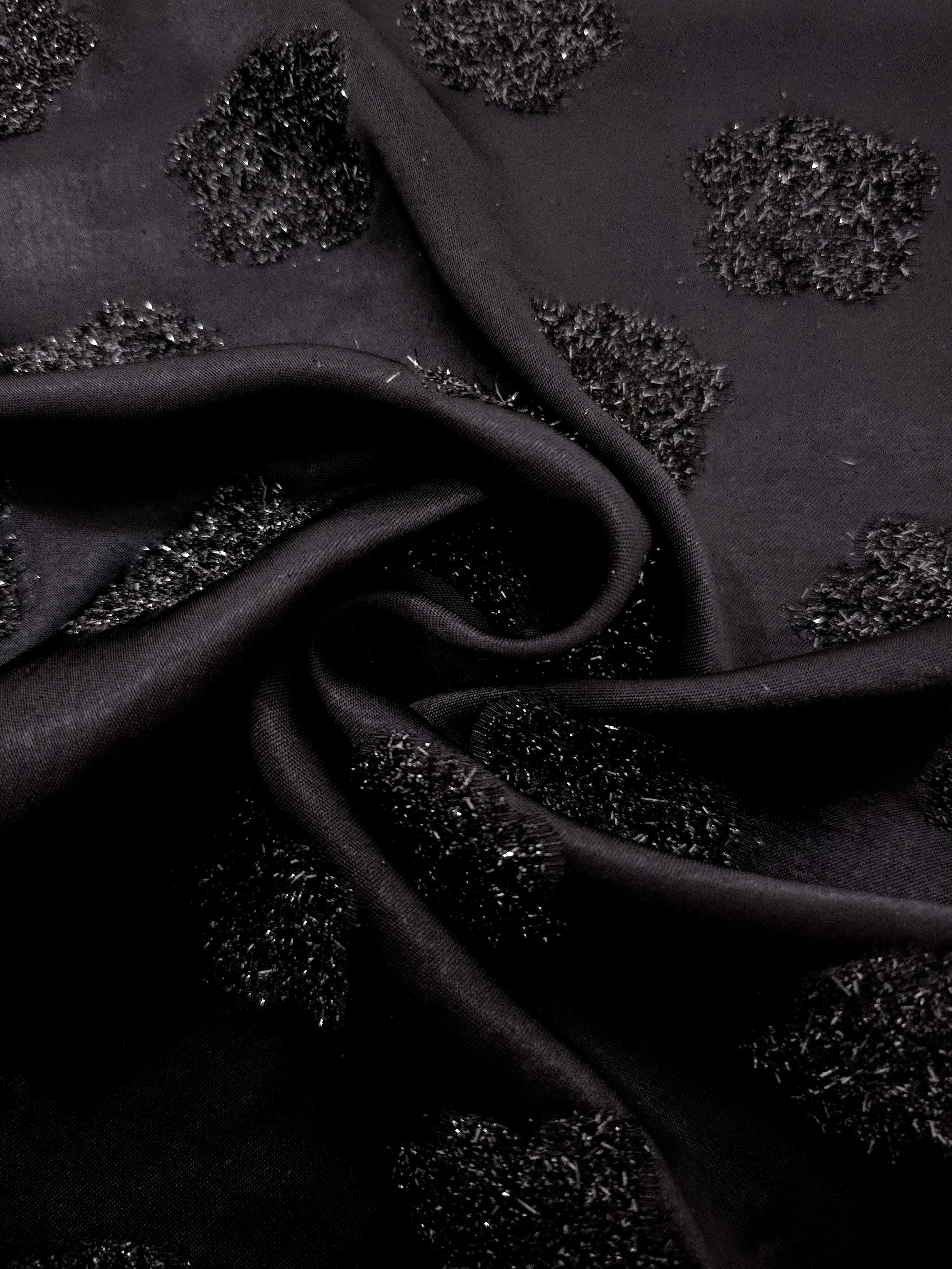 Folded Metallic Black viscose jacquard fabric with organic metallic pebble motif