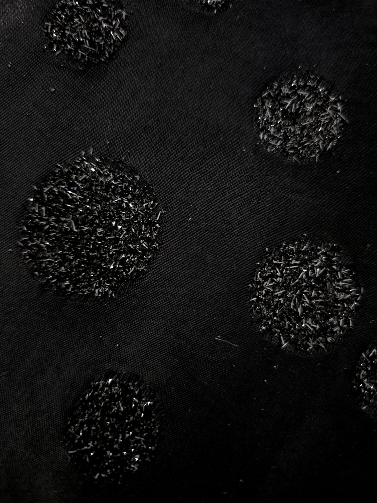 Draped Metallic Black viscose jacquard fabric with reflective confetti dot pattern