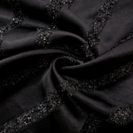 Folded Metallic Black viscose jacquard fabric with slim reflective stripes