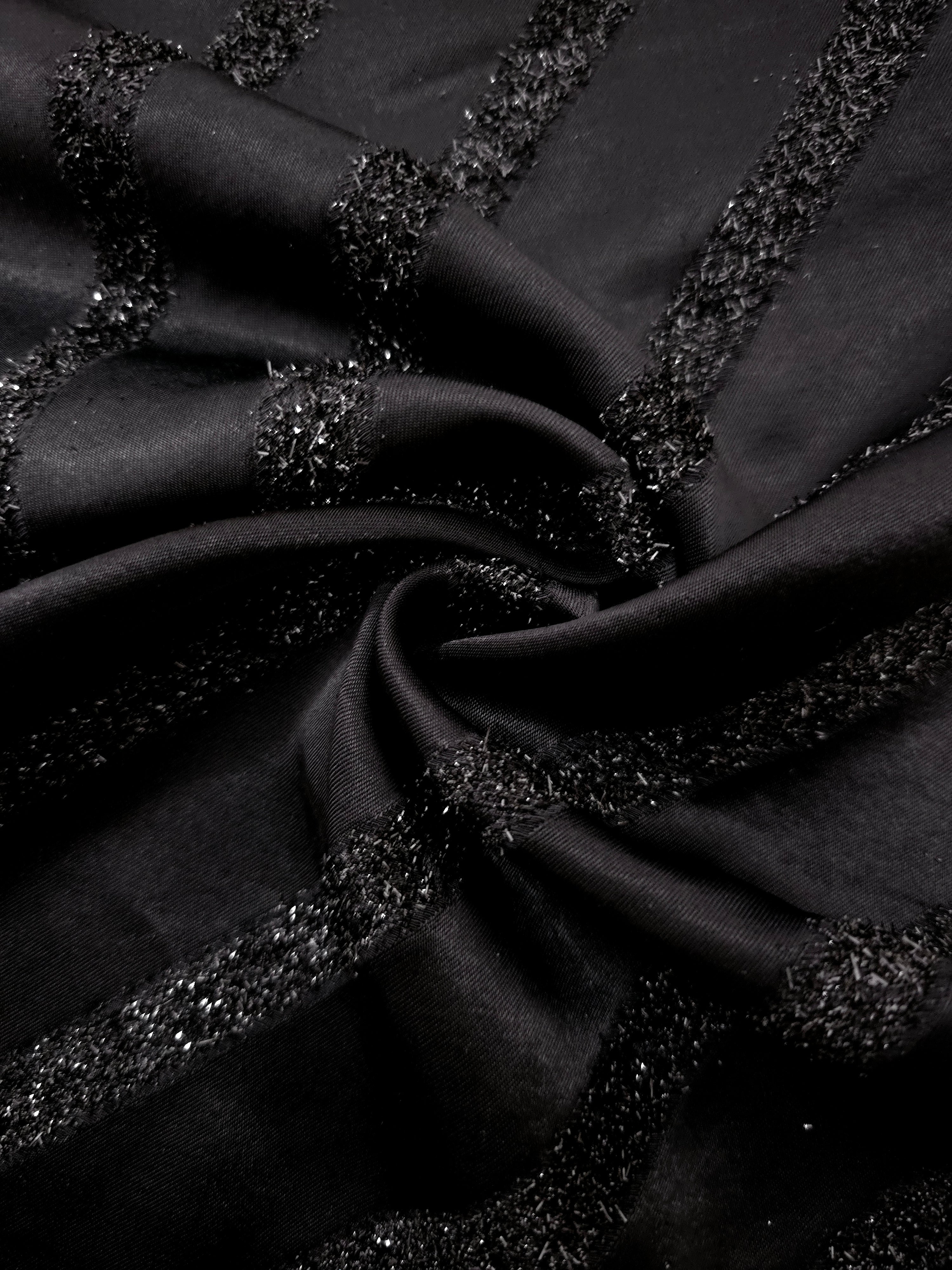 Folded Metallic Black viscose jacquard fabric with slim reflective stripes