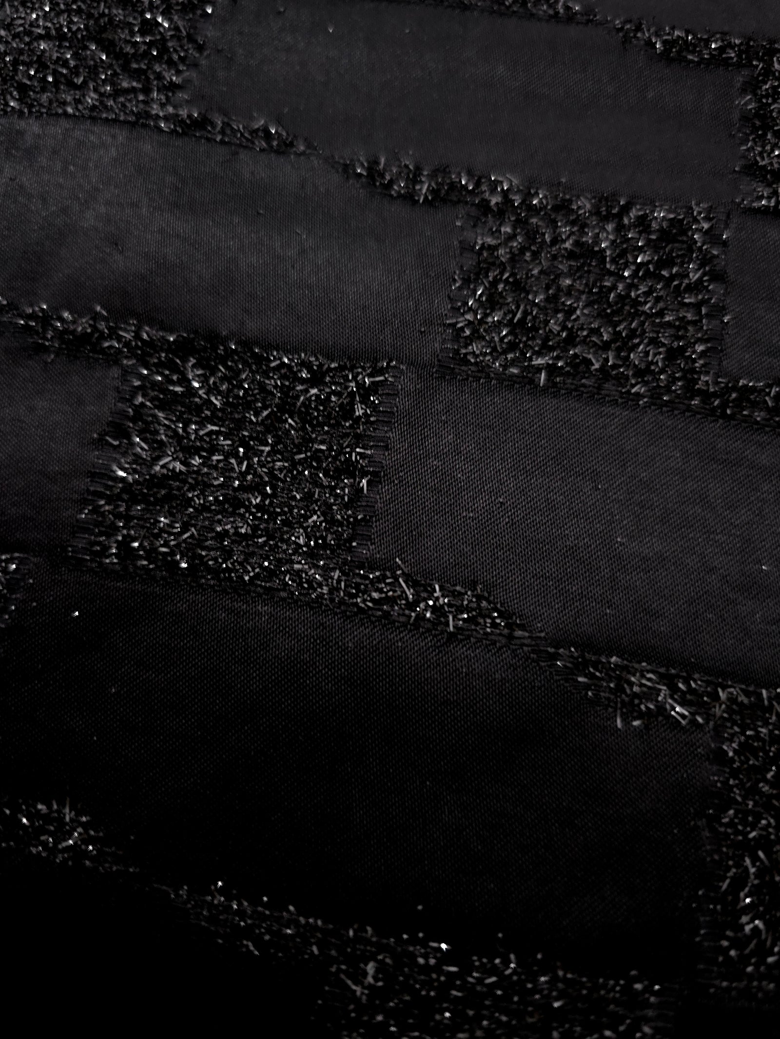 Draped Metallic Black viscose jacquard fabric with woven metallic grid pattern