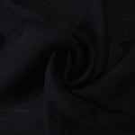 Draped texture of formal black small leaf embossed viscose jacquard fabric.