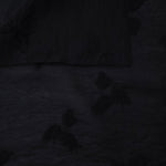 Front and back view of formal black small leaf embossed viscose jacquard fabric.