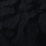 Close texture of black abstract scroll jacquard with darker pattern on lyocell viscose base.
