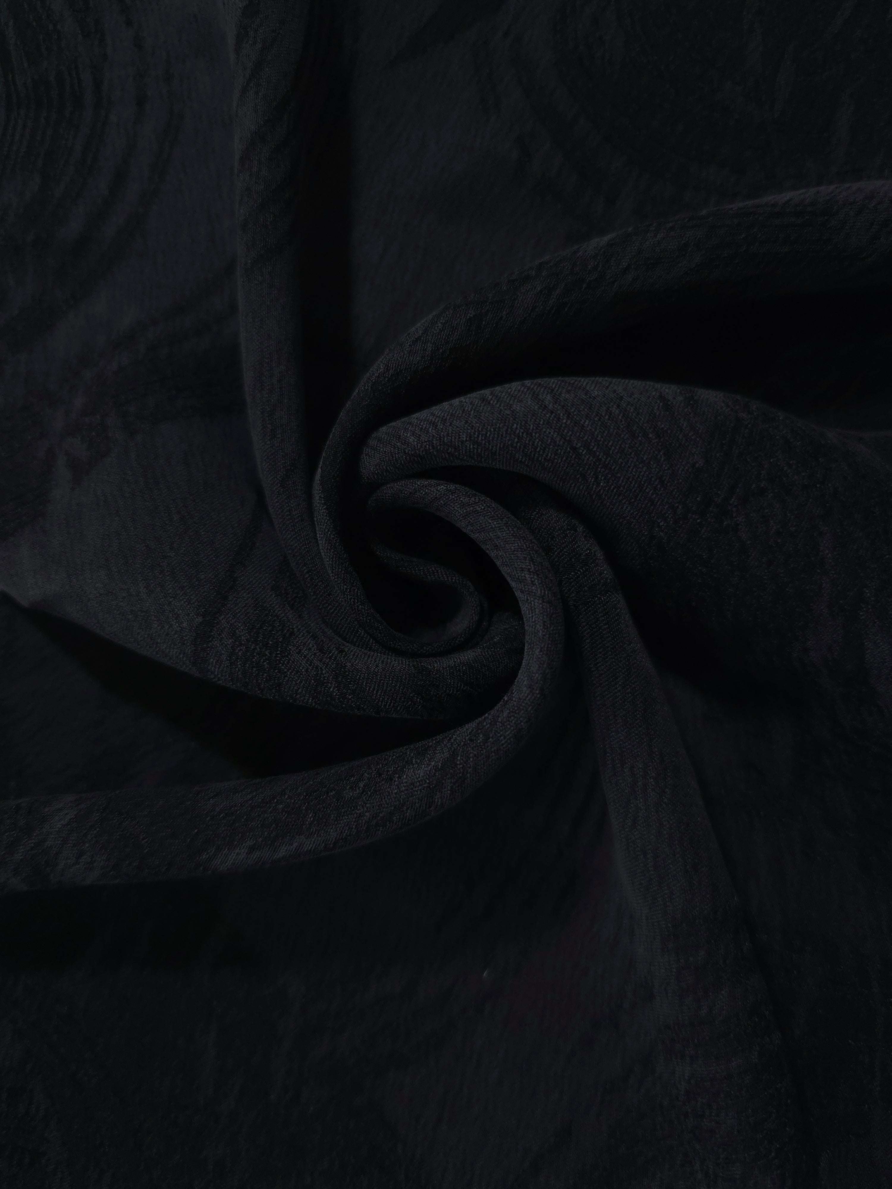 Swirl drape of black abstract brushstroke jacquard with soft woven contrast.
