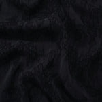 Draped black botanical floral jacquard showing textured flow for occasionwear.