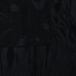 Selvage detail of black botanical scroll lyocell viscose jacquard for matching edges.