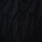 Black brushstroke leaf lyocell viscose jacquard with tonal woven pattern for dresses.