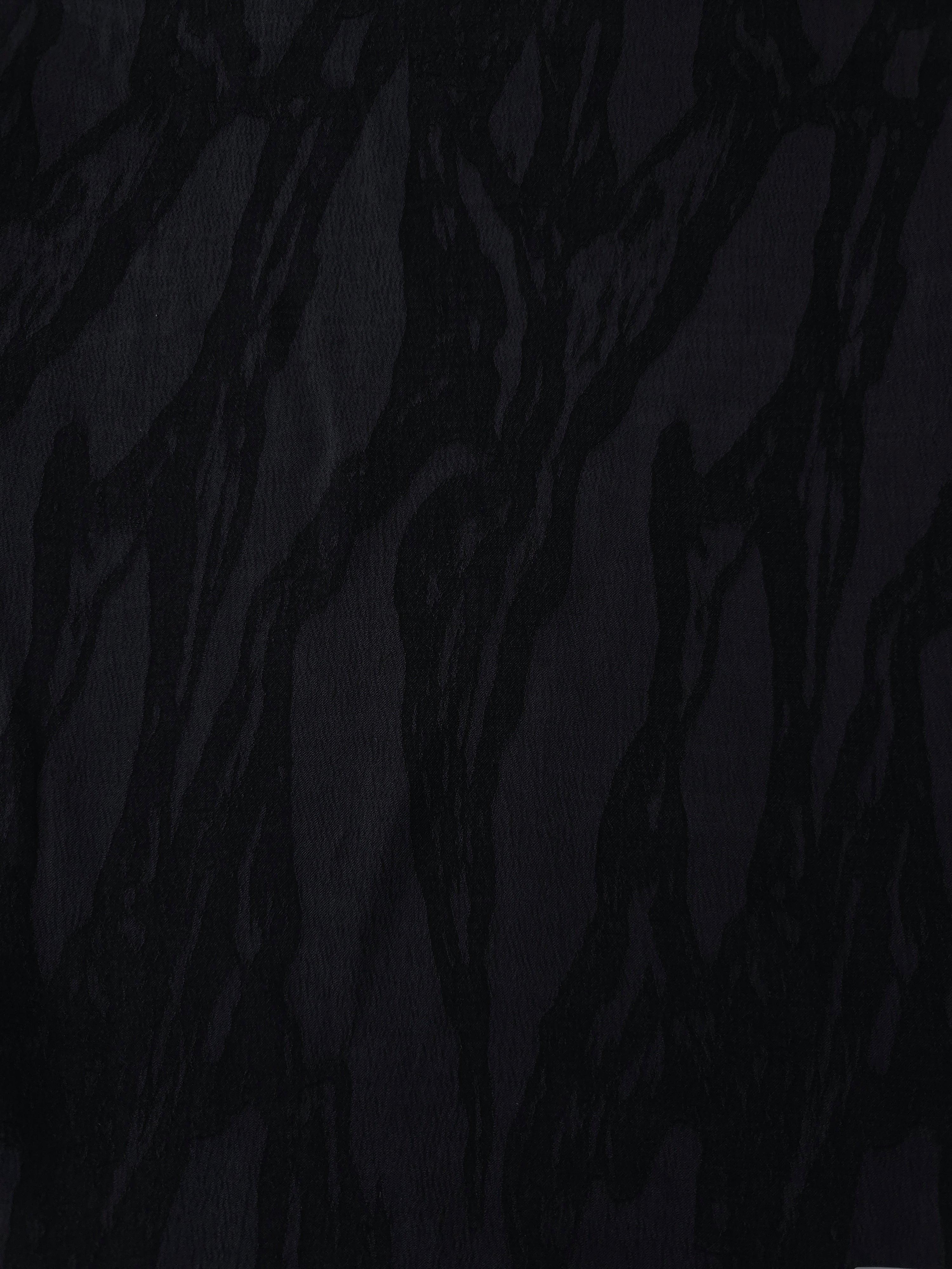 Black brushstroke leaf lyocell viscose jacquard with tonal woven pattern for dresses.
