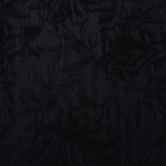 Black dense floral vine lyocell viscose jacquard with tonal bloom texture for dresses.