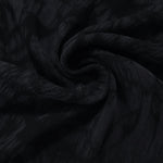 Folded black dense floral jacquard in lyocell viscose for evening and occasion sewing.