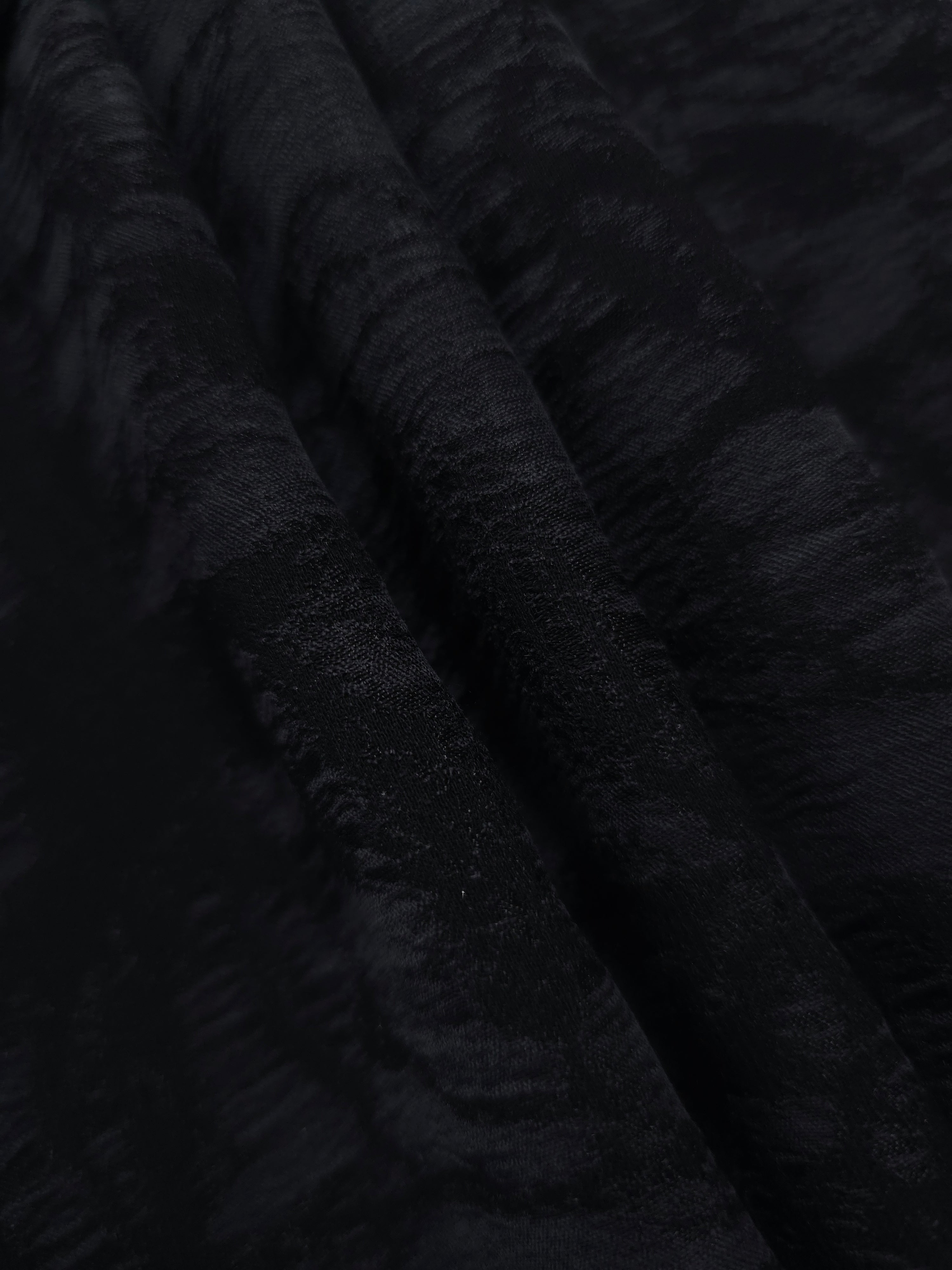 Swirl drape of black floral vine lyocell viscose jacquard with soft tonal contrast.