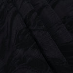 Folded black large leaf lyocell viscose jacquard for statement garment panels.