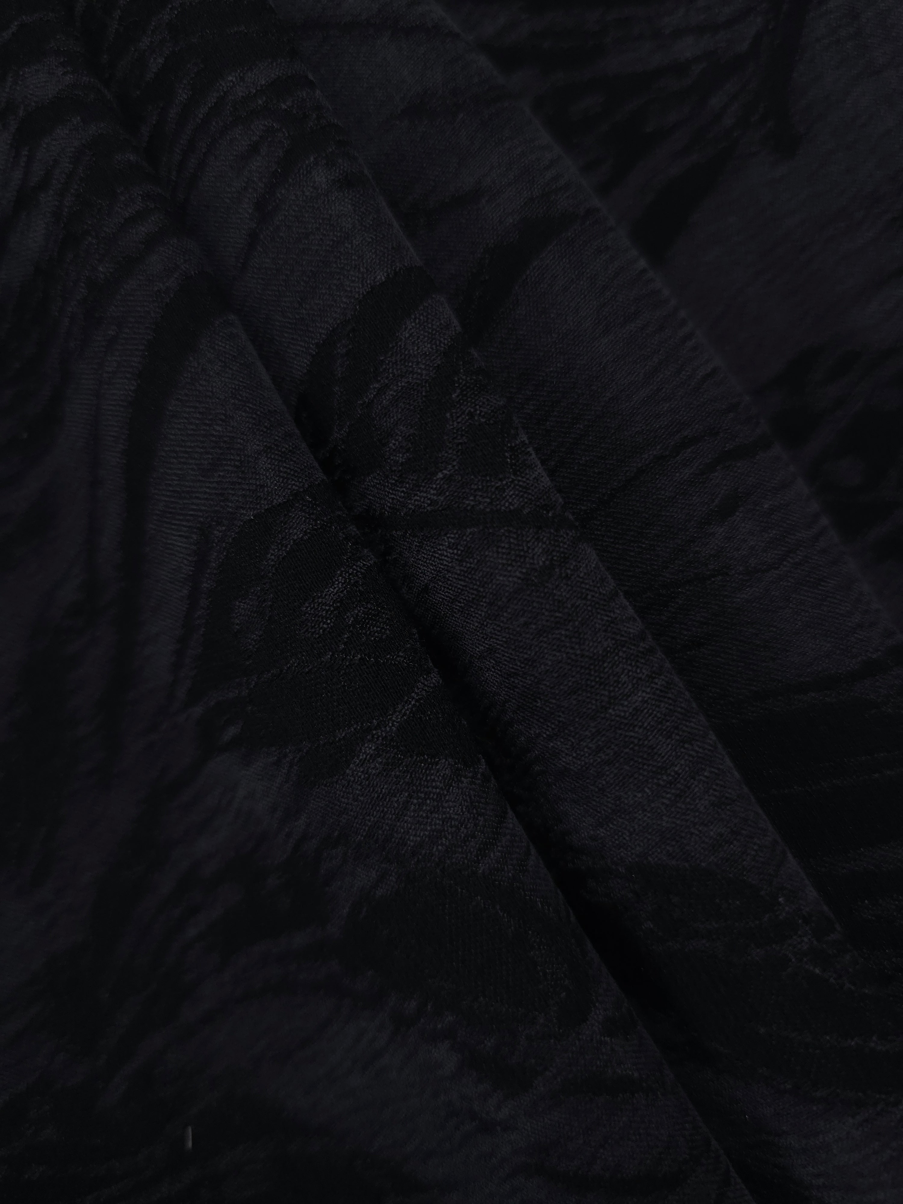 Folded black large leaf lyocell viscose jacquard for statement garment panels.