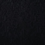 Black ornamental floral lyocell viscose jacquard with tonal pattern for dressmaking.