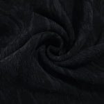 Swirl drape of black ornamental floral jacquard with darker tonal surface pattern.