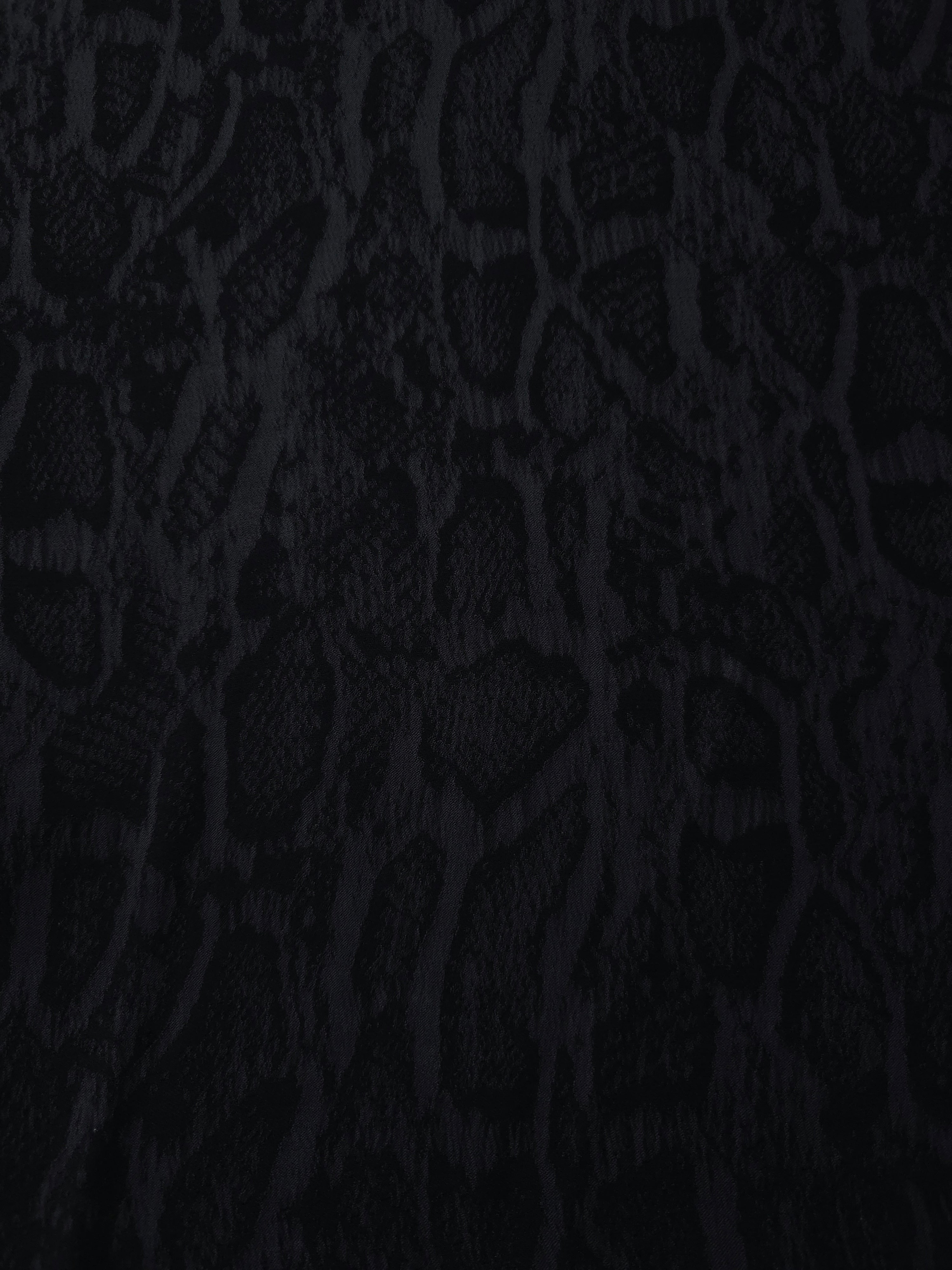 Black paisley vine lyocell viscose jacquard with tonal woven pattern for dresses.