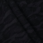 Folded black paisley vine lyocell viscose jacquard for jackets and dress panels.
