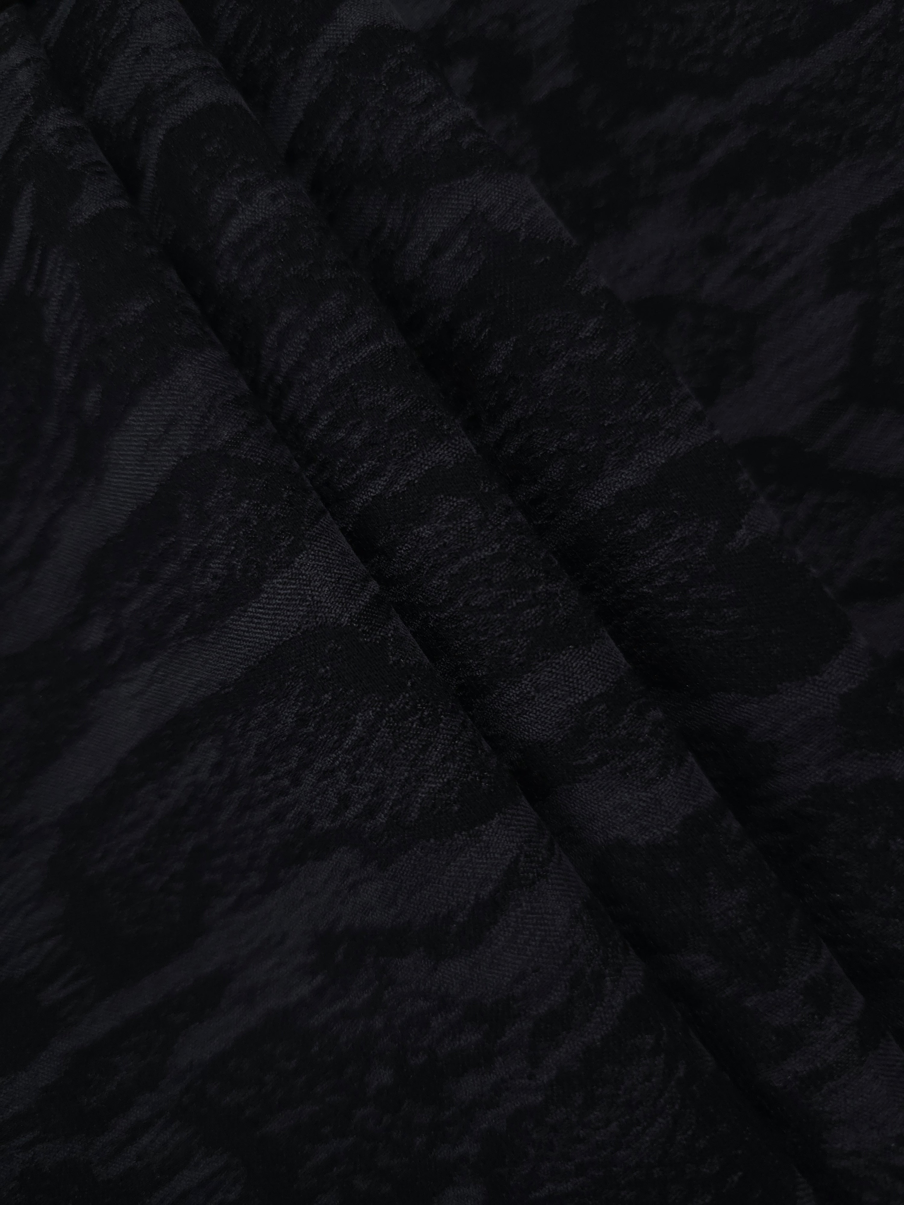 Folded black paisley vine lyocell viscose jacquard for jackets and dress panels.