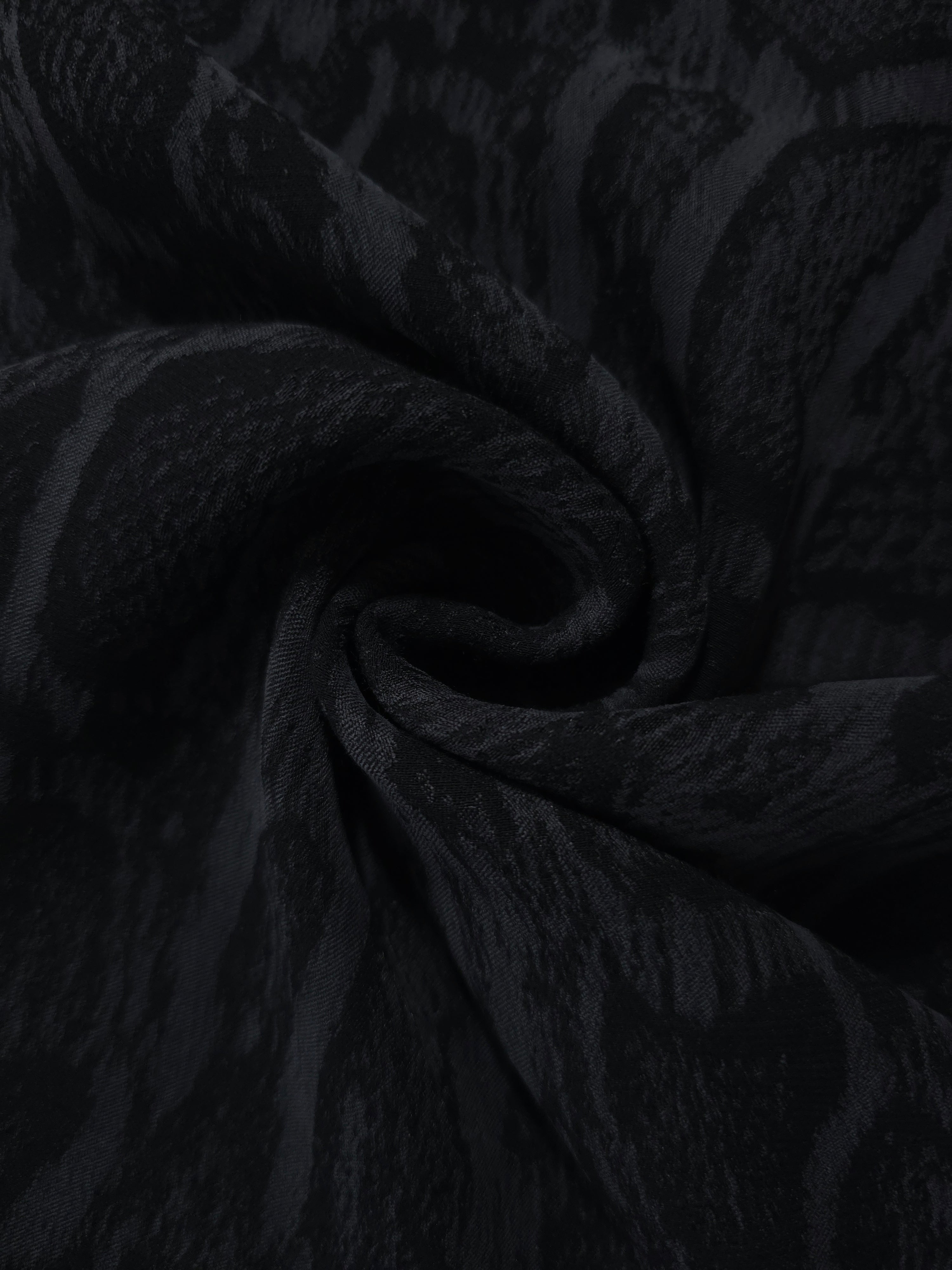 Swirl drape of black paisley vine jacquard with tonal lyocell viscose sheen.
