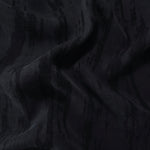 Draped black bark stripe lyocell viscose jacquard showing firm flow for jackets and dresses.