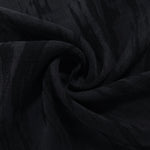 Swirl drape of black bark stripe lyocell viscose jacquard with darker woven contrast.