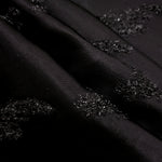Detail view of Metallic Black viscose metallic jacquard with painterly art strokes