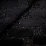 Close-up of Metallic Black viscose jacquard with embossed crosshatch basket weave