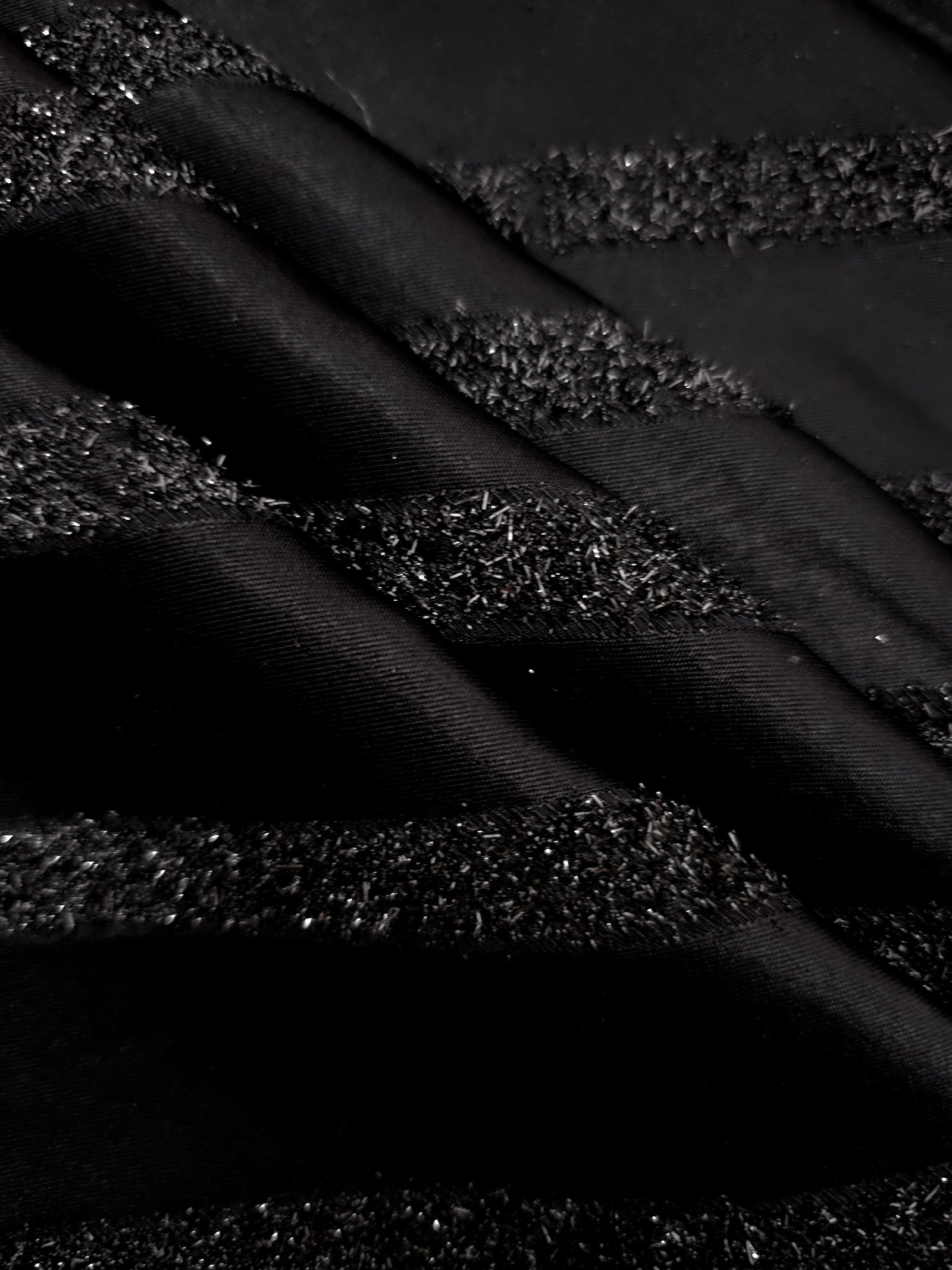 Detail view of Metallic Black viscose metallic jacquard with hairline stripe motif