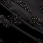 Detail view of Metallic Black viscose metallic jacquard with raised pebble texture
