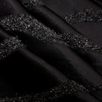 Detail view of Metallic Black viscose metallic jacquard with sinuous wave lines