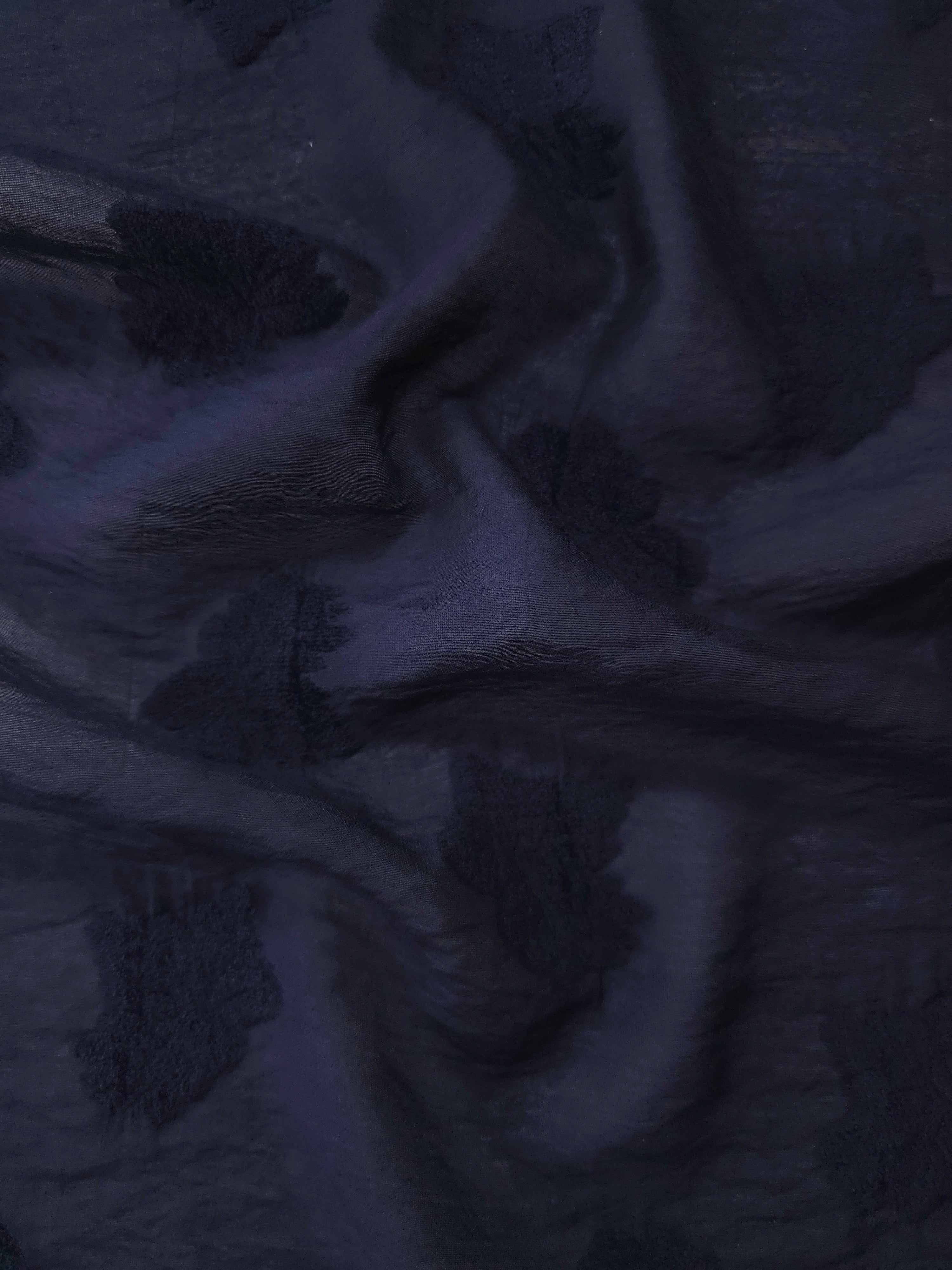 Pattern detail of dark blue big leaf embossed viscose jacquard fabric for layered dresses.