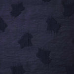 Soft drape of dark blue big leaf embossed viscose jacquard fabric for sheer garment layers.