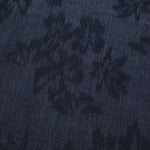 Blue botanical floral lyocell viscose jacquard showing woven pattern for occasion dress fabric.