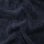 Draped blue lyocell viscose jacquard showing floral sheen for fluid dresses and blouses.