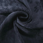 Blue lyocell viscose jacquard in a swirl drape showing botanical floral movement.